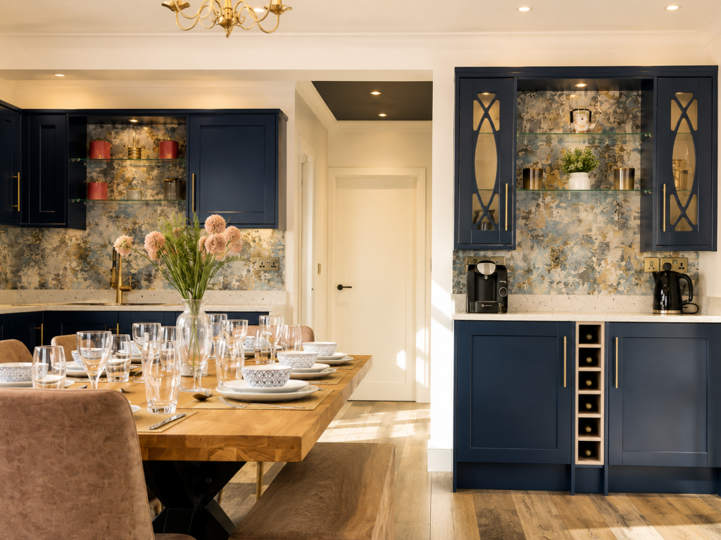 Luxury kitchen extension with dark cabinetry and overhead glazing